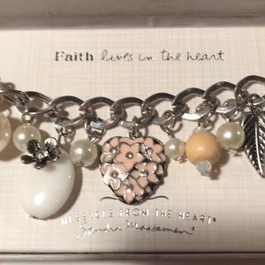 Charm bracelet "Faith lives in the heart" by Sandra Magsemen. New in box.